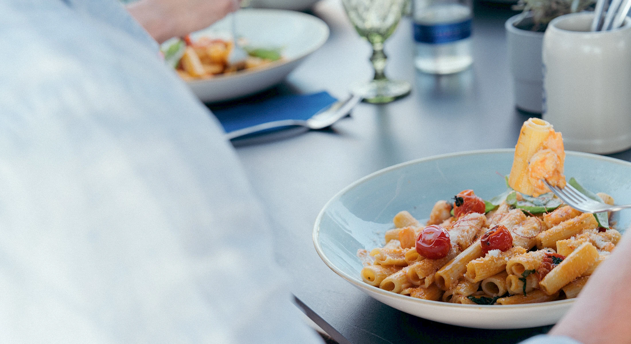 Pasta dish on the terrace with lake view